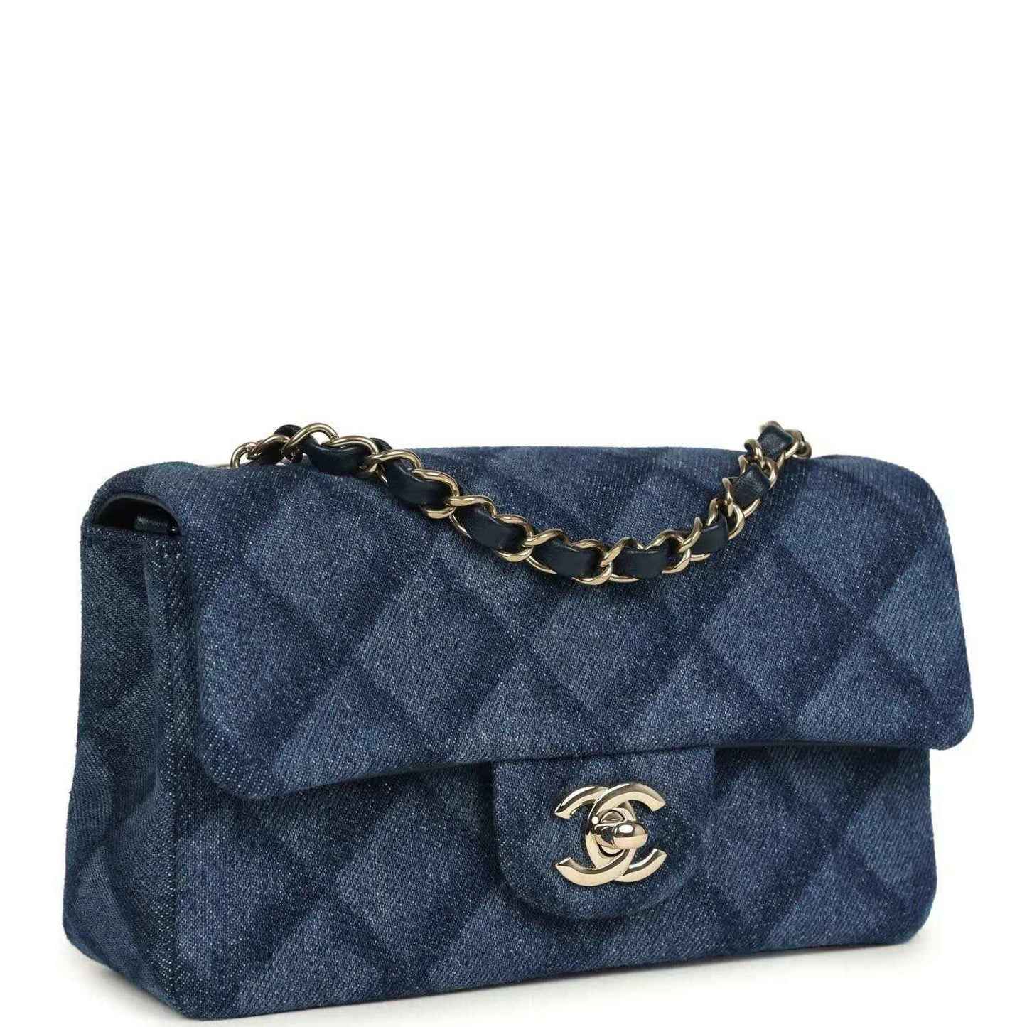 Chanel mini flap bag, side view, blue denim with gold chain strap and logo clasp