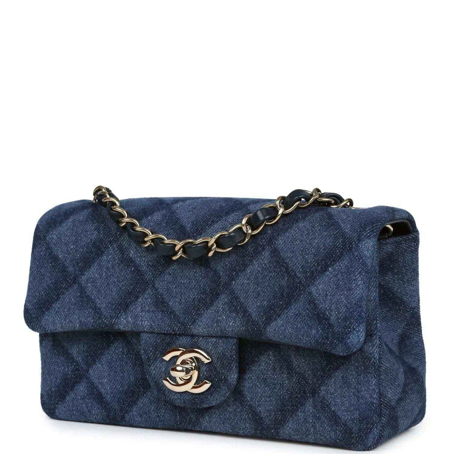 Chanel mini flap bag, angled view, blue denim with gold chain strap and logo clasp