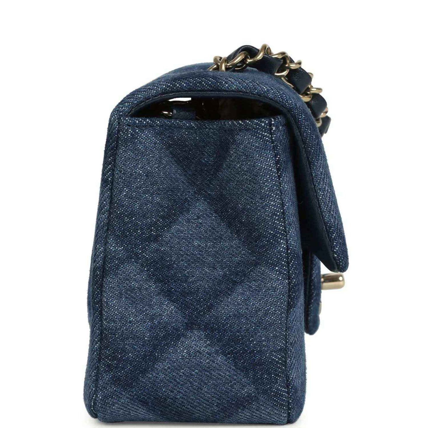 Chanel mini flap bag, back view, blue denim with gold chain and top handle