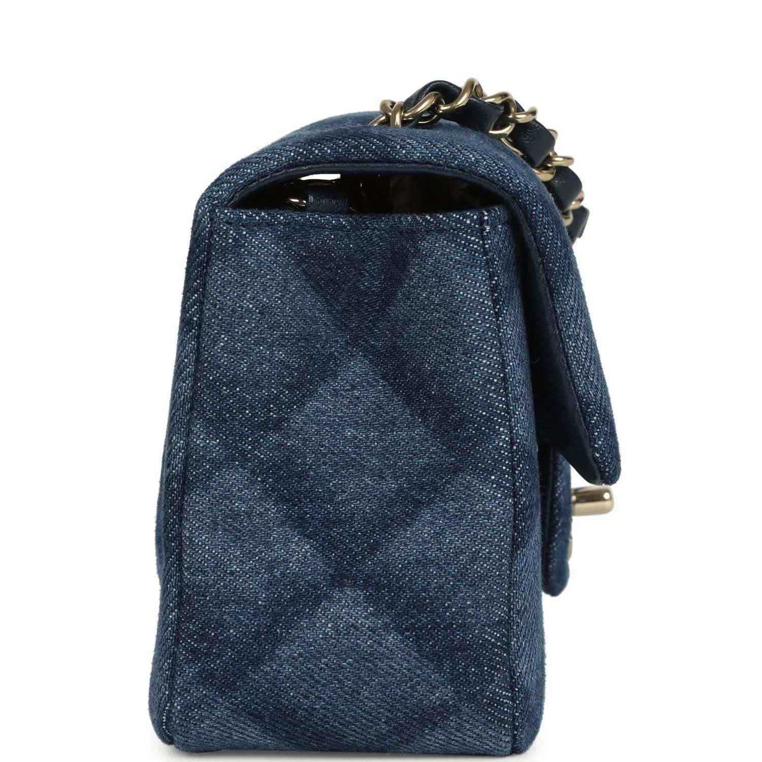 Chanel mini flap bag, back view, blue denim with gold chain and top handle