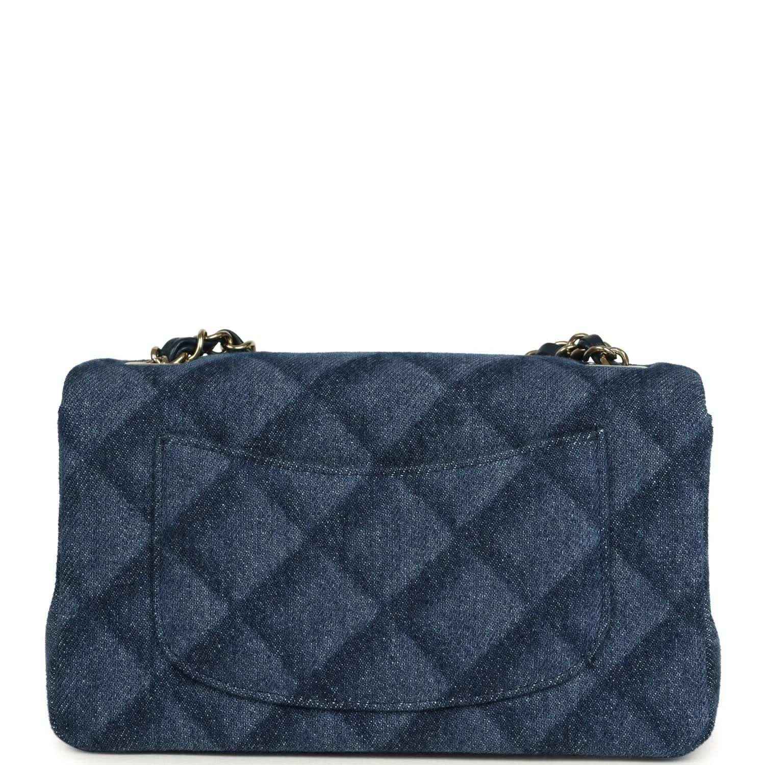 Chanel mini flap bag, front view, blue denim quilted design and gold logo clasp