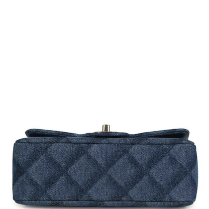Chanel mini flap bag, bottom view, blue denim base with metal turn-lock
