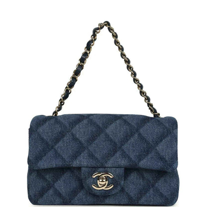 Chanel mini flap bag, front view with chain, blue denim and gold logo clasp