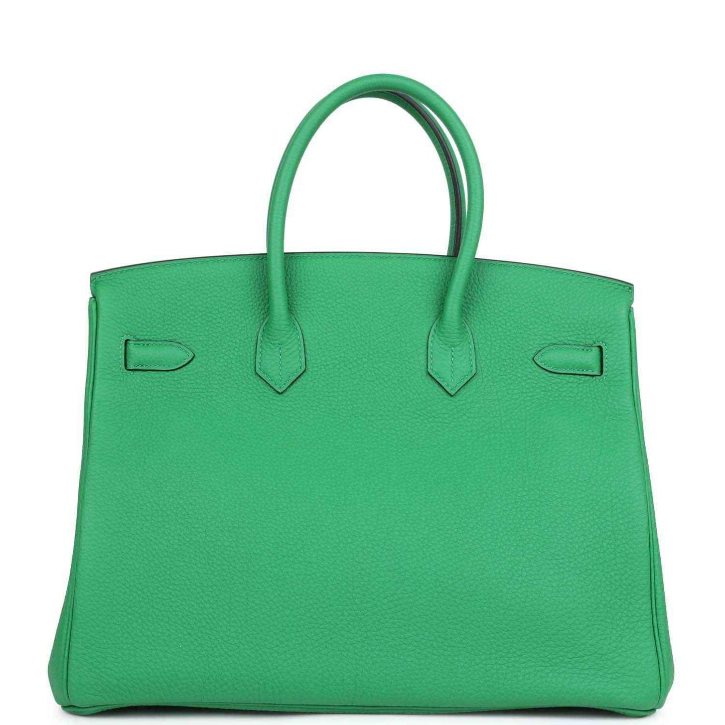 Green leather top-handle handbag with rear panel and inset pocket details