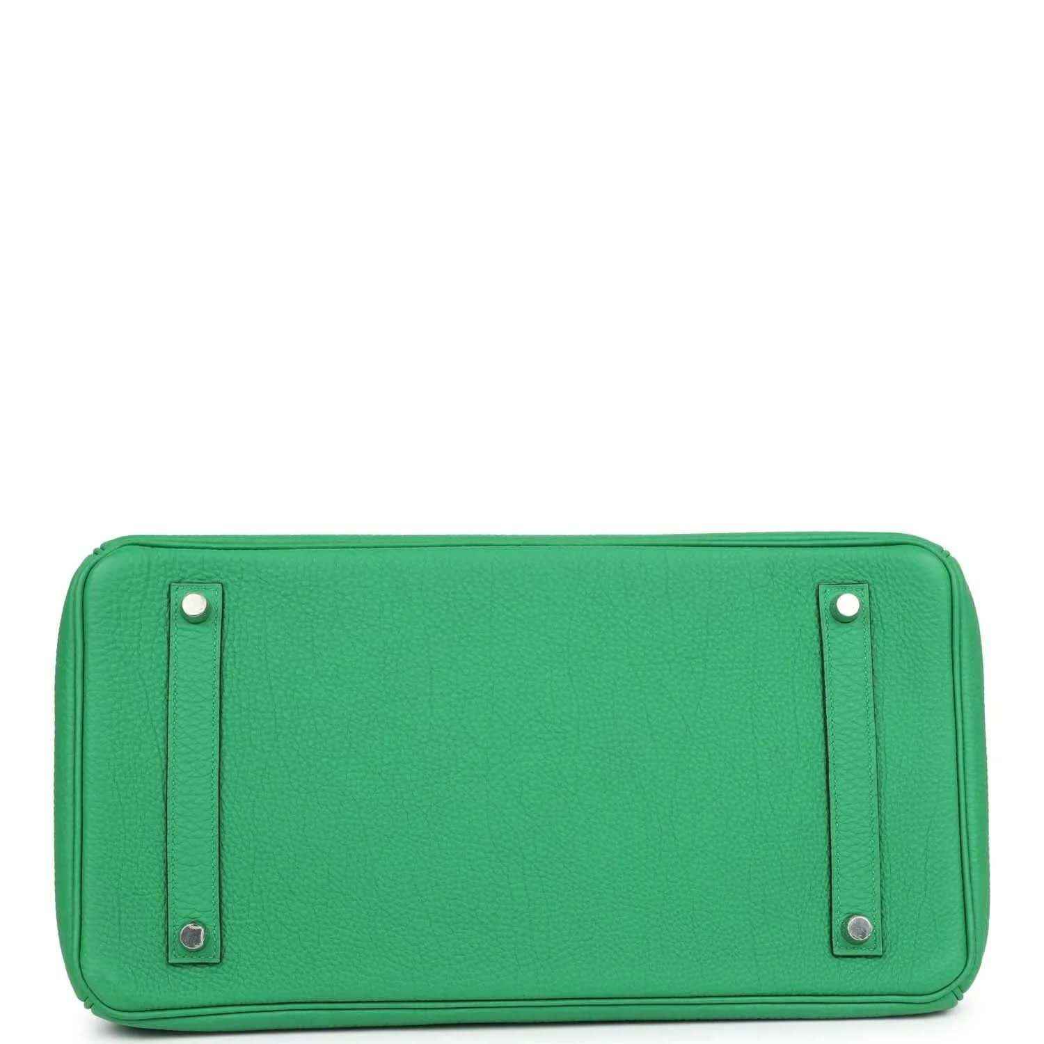Green leather handbag base with snap pockets and metal corner hardware
