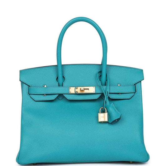 Blue peacock leather handbag with gold lock clasp and dangling key charm