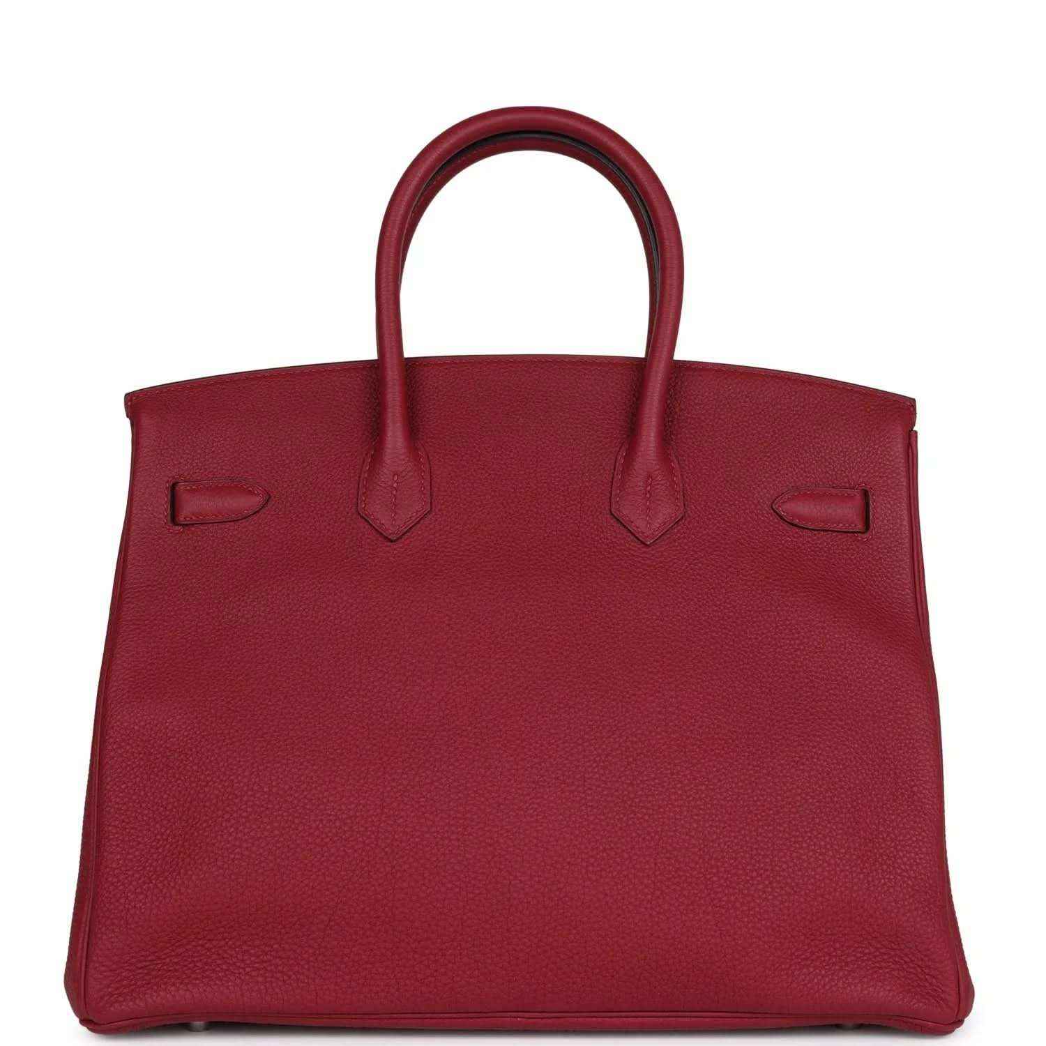 Red leather Birkin-style handbag front panel with embossed pockets and top handles