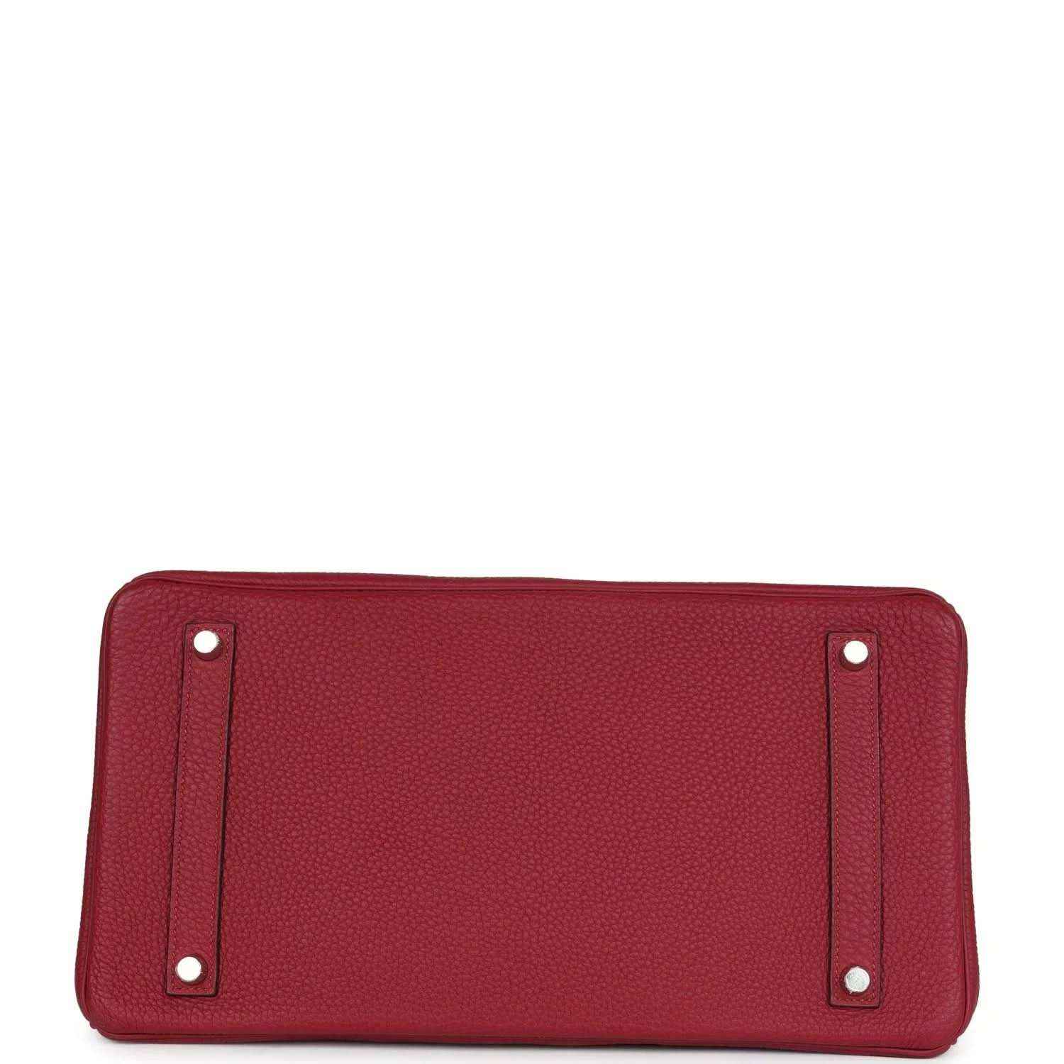 Red leather handbag base with rounded corners and metal feet on the bottom panel