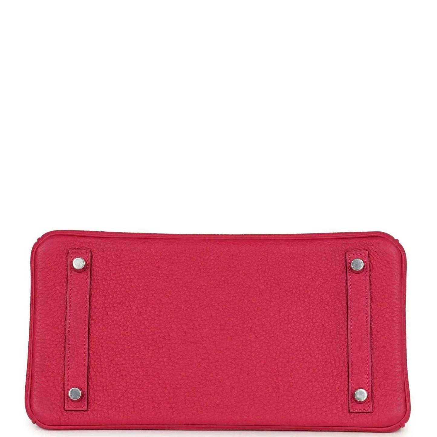 Pink Birkin handbag base view with four protective feet and silver studs.