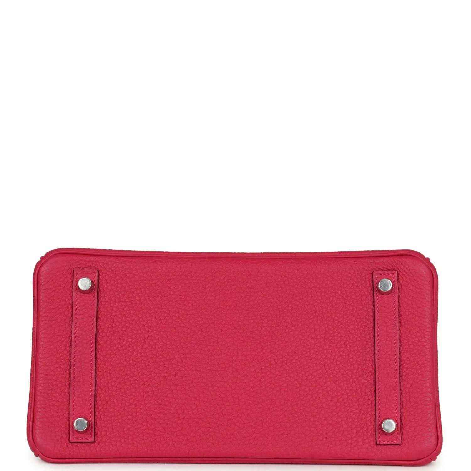 Pink Birkin handbag base view with four protective feet and silver studs.