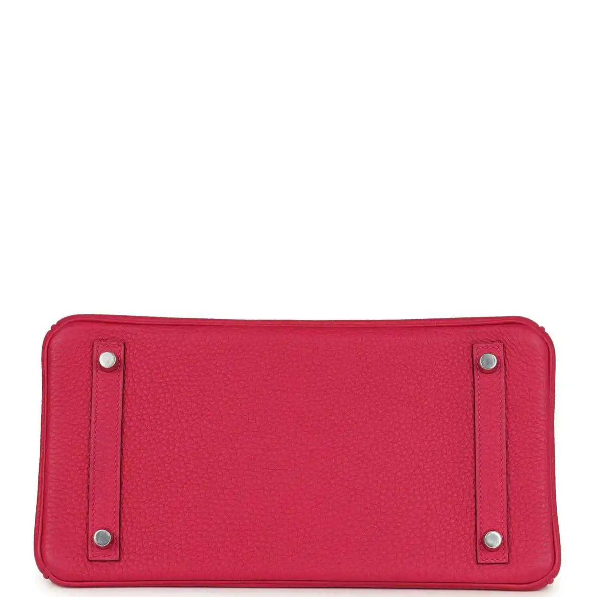 Pink Birkin handbag base view with four protective feet and silver studs.