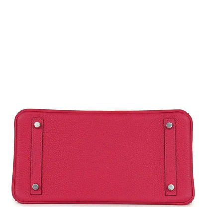 Pink Birkin handbag base view with four protective feet and silver studs.