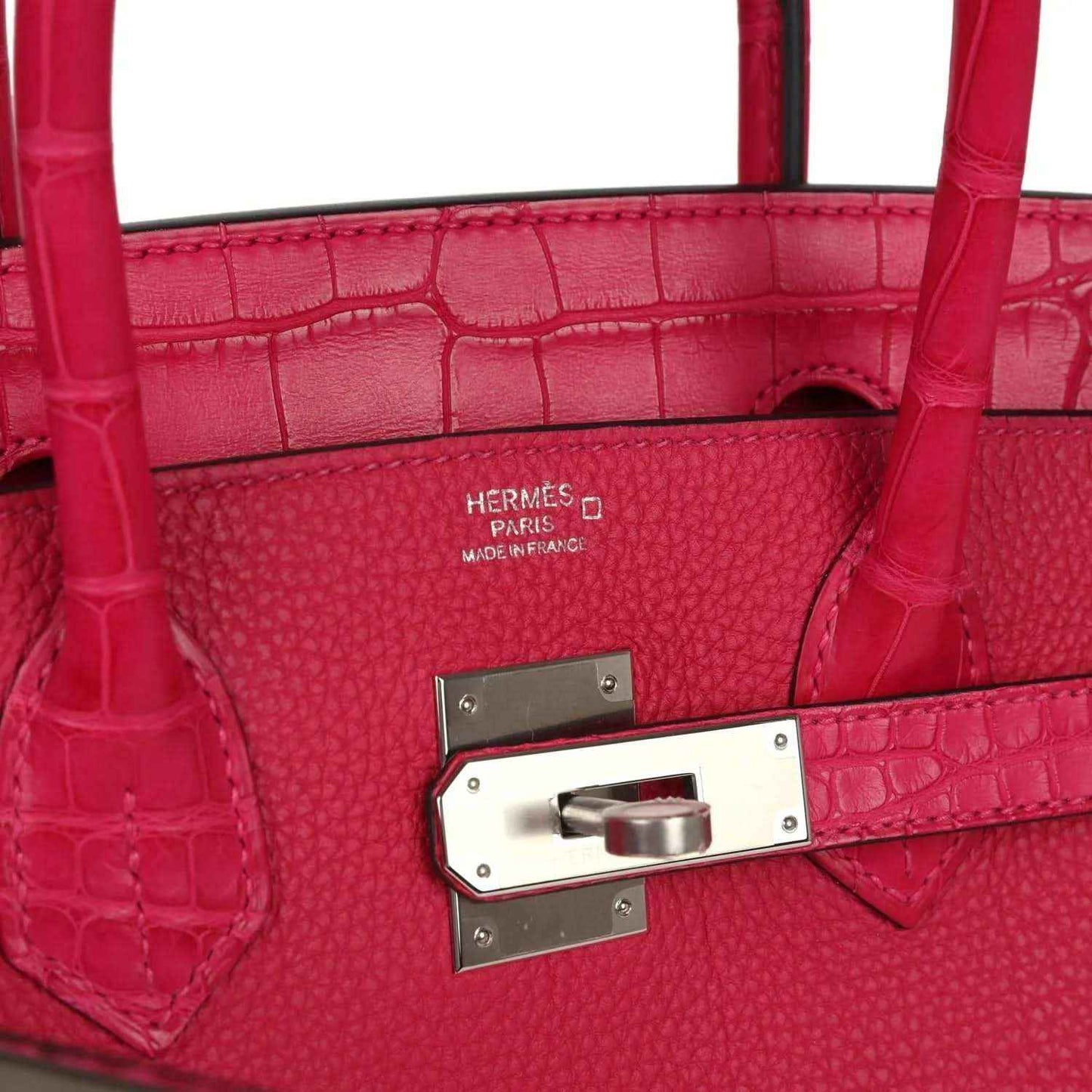 Pink Birkin handbag interior lining with stamp and front closure plate.