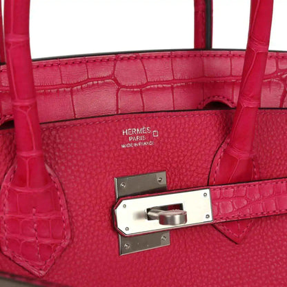 Pink Birkin handbag interior lining with stamp and front closure plate.