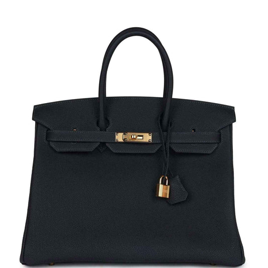 Hermes Birkin leather handbag with front flap, gold lock and hanging charm, dark color