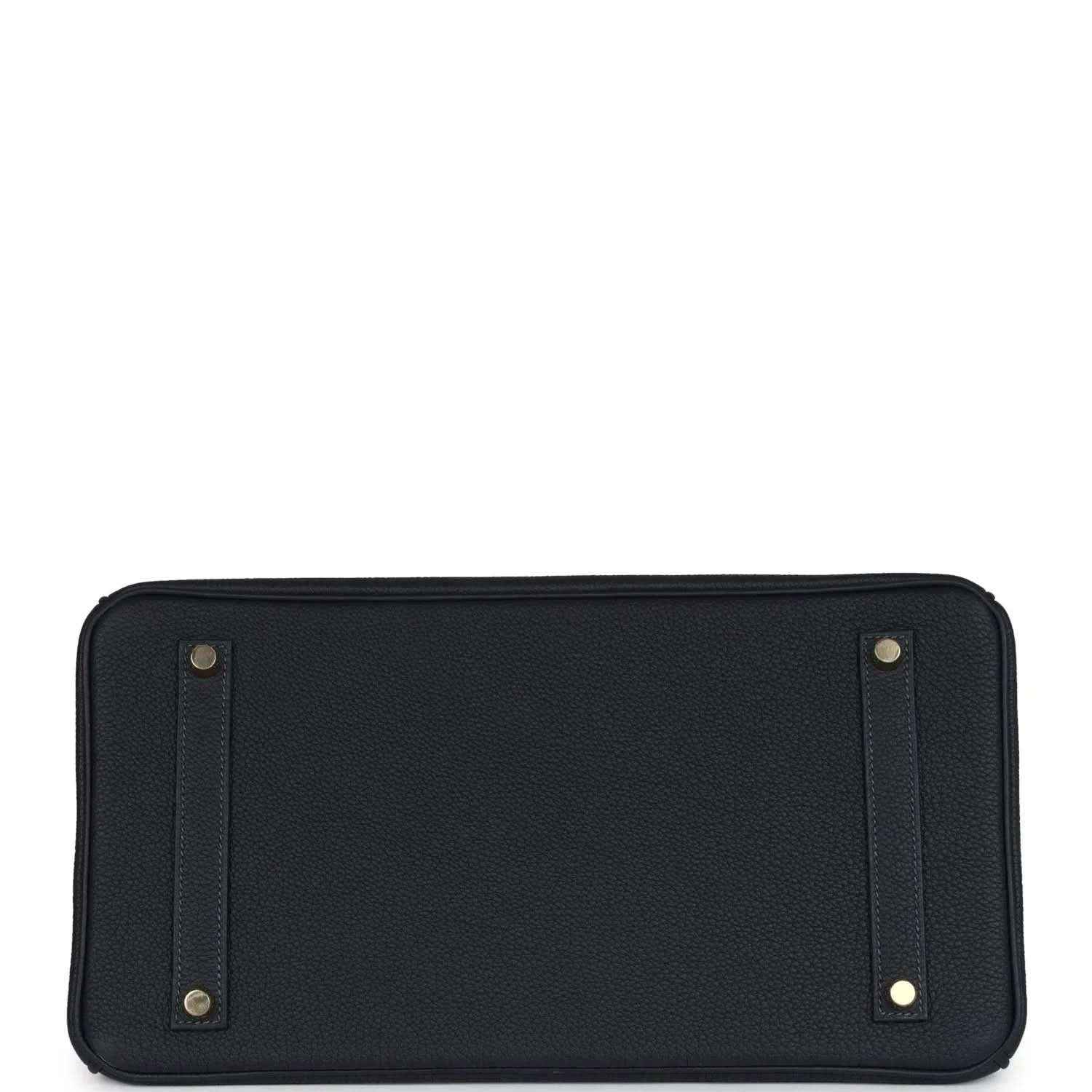 Leather handbag base panel with gold corner studs and stitched edges, dark color