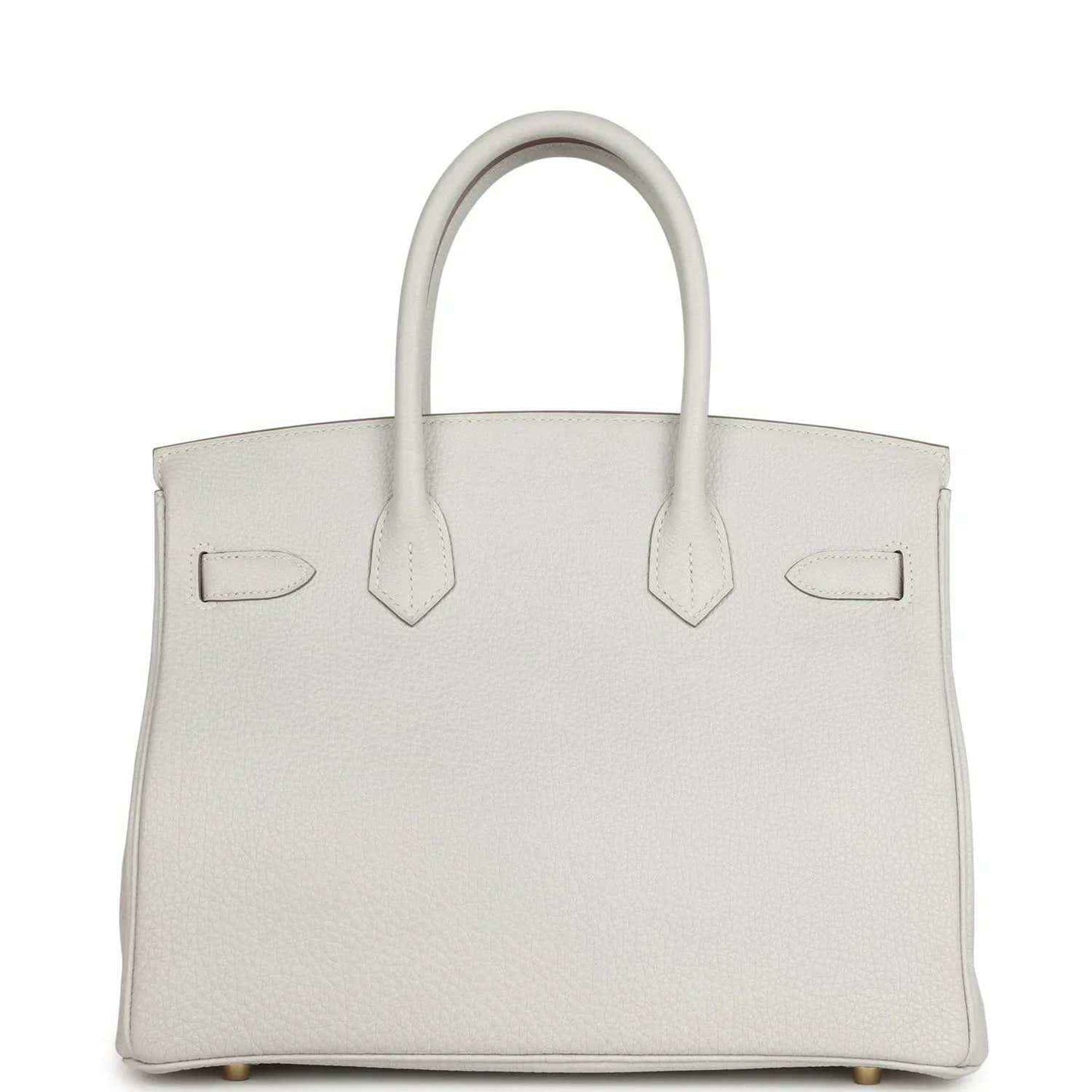 Light gray leather handbag front view with three panel straps, top handles, gold-toned details