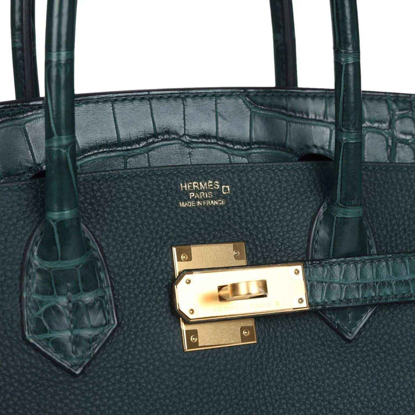 Hermes Birkin handbag interior view with gold clasp and 'Hermes Paris' stamp