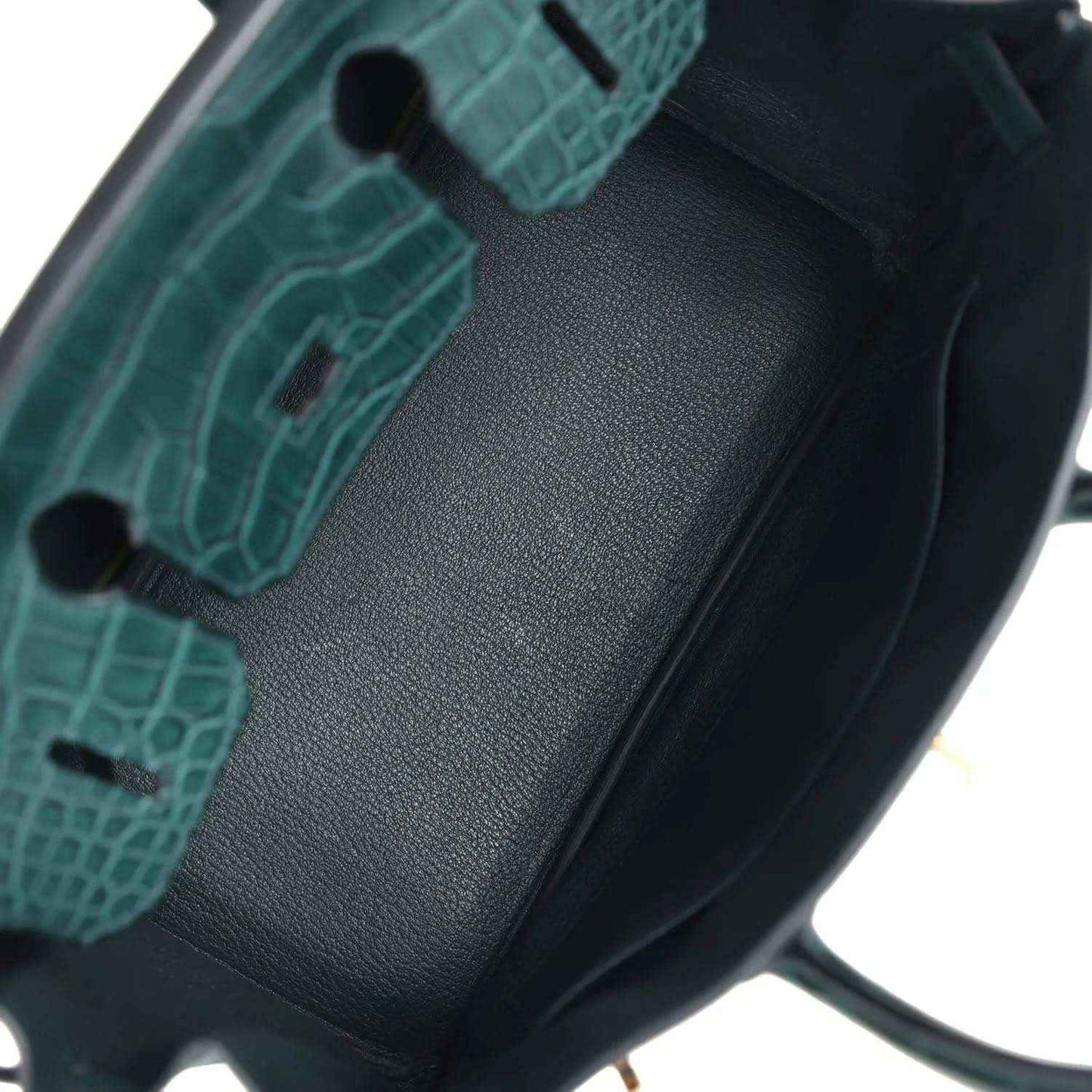 Birkin handbag interior lining detail in dark green with textured insert