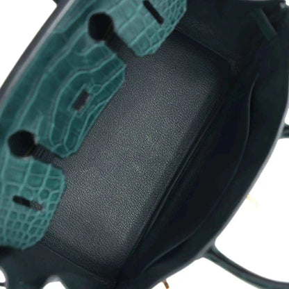 Birkin handbag interior lining detail in dark green with textured insert