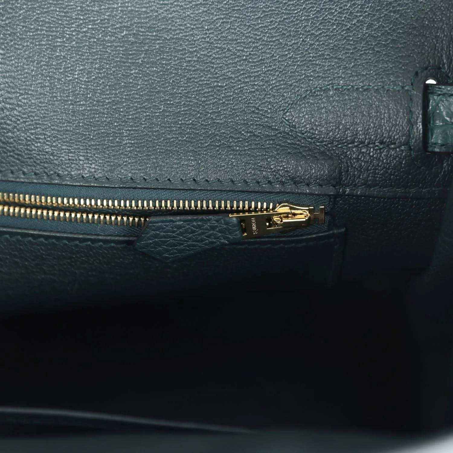 Birkin handbag interior zipper pocket in dark green leather with gold zipper pull