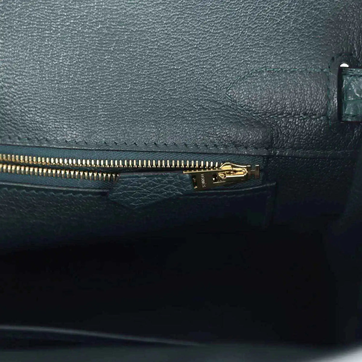 Birkin handbag interior zipper pocket in dark green leather with gold zipper pull