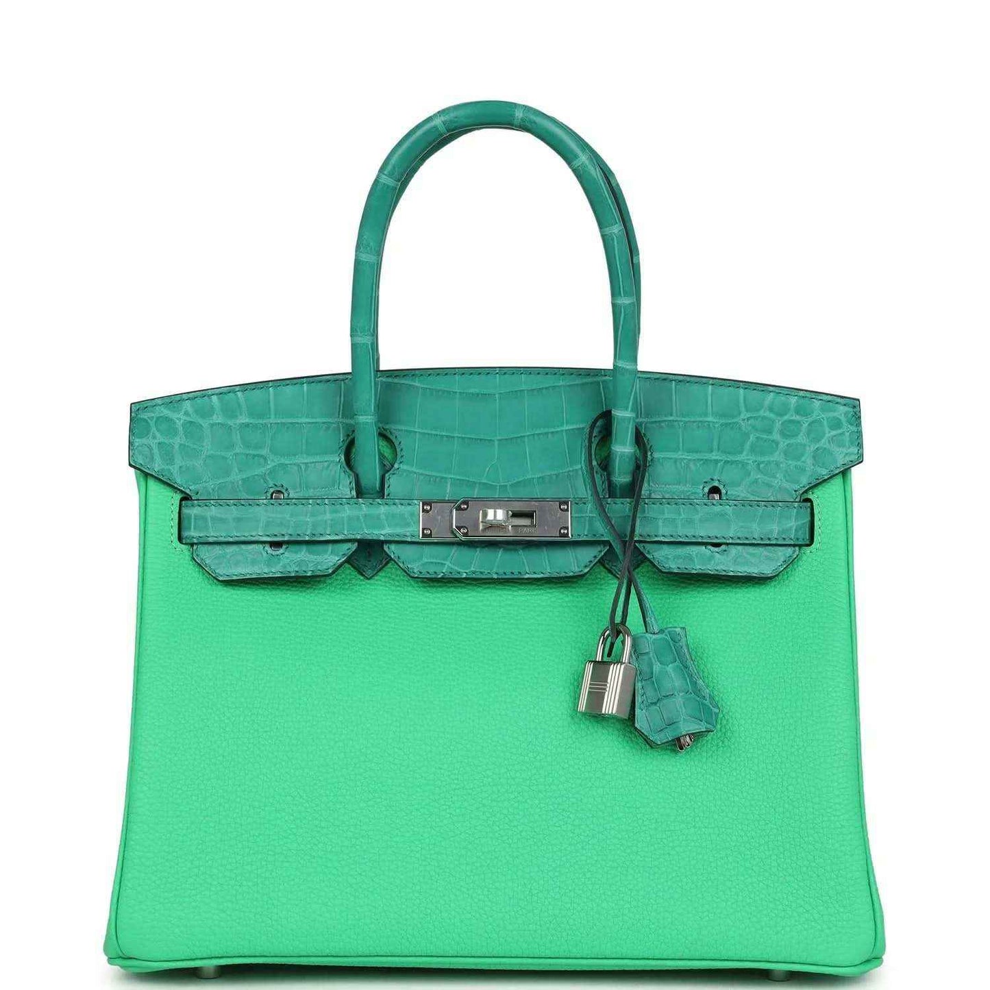 Green leather handbag with crocodile-texture panels, top handle, and front flap clasp