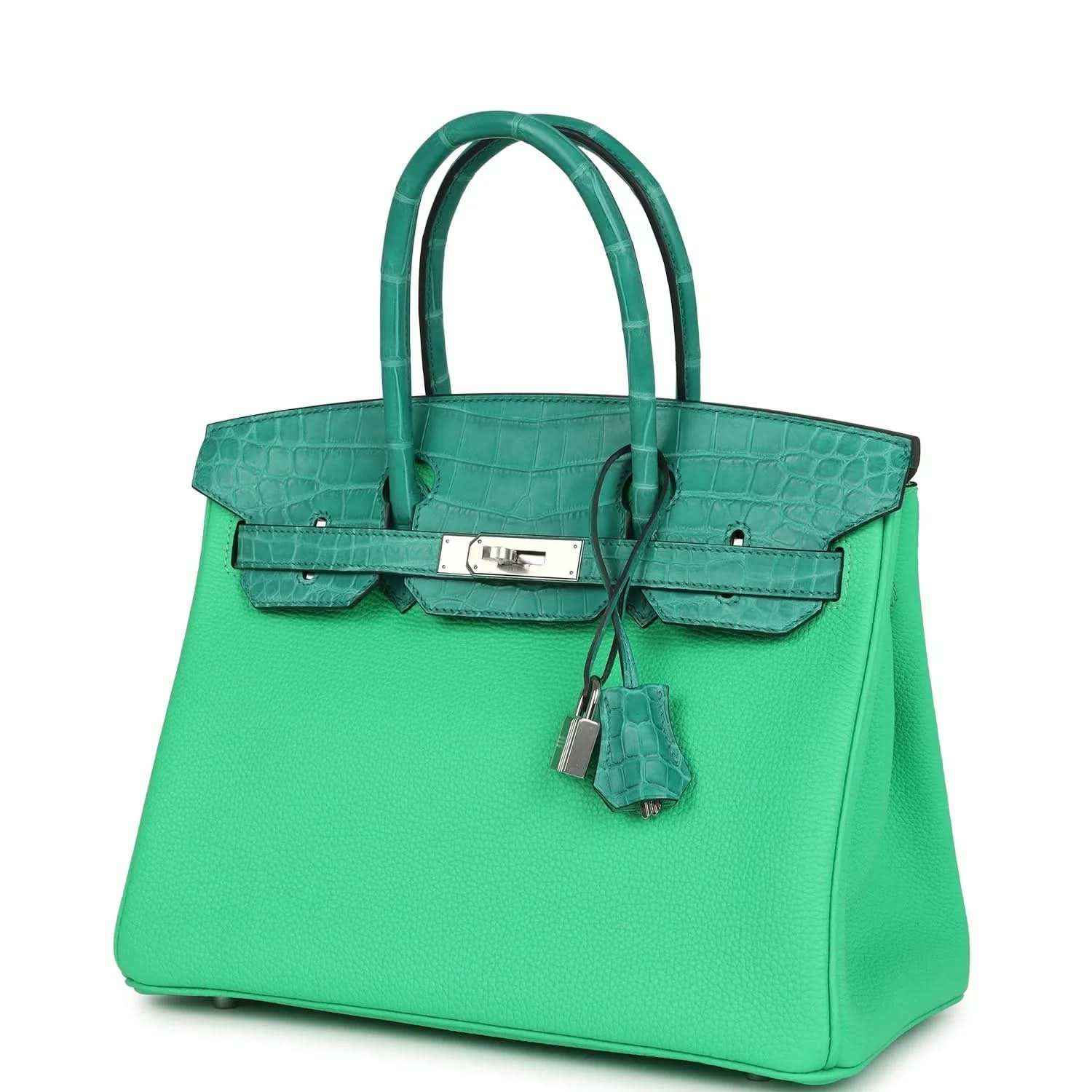 Green leather handbag with crocodile texture, front clasp, and hanging lock charm
