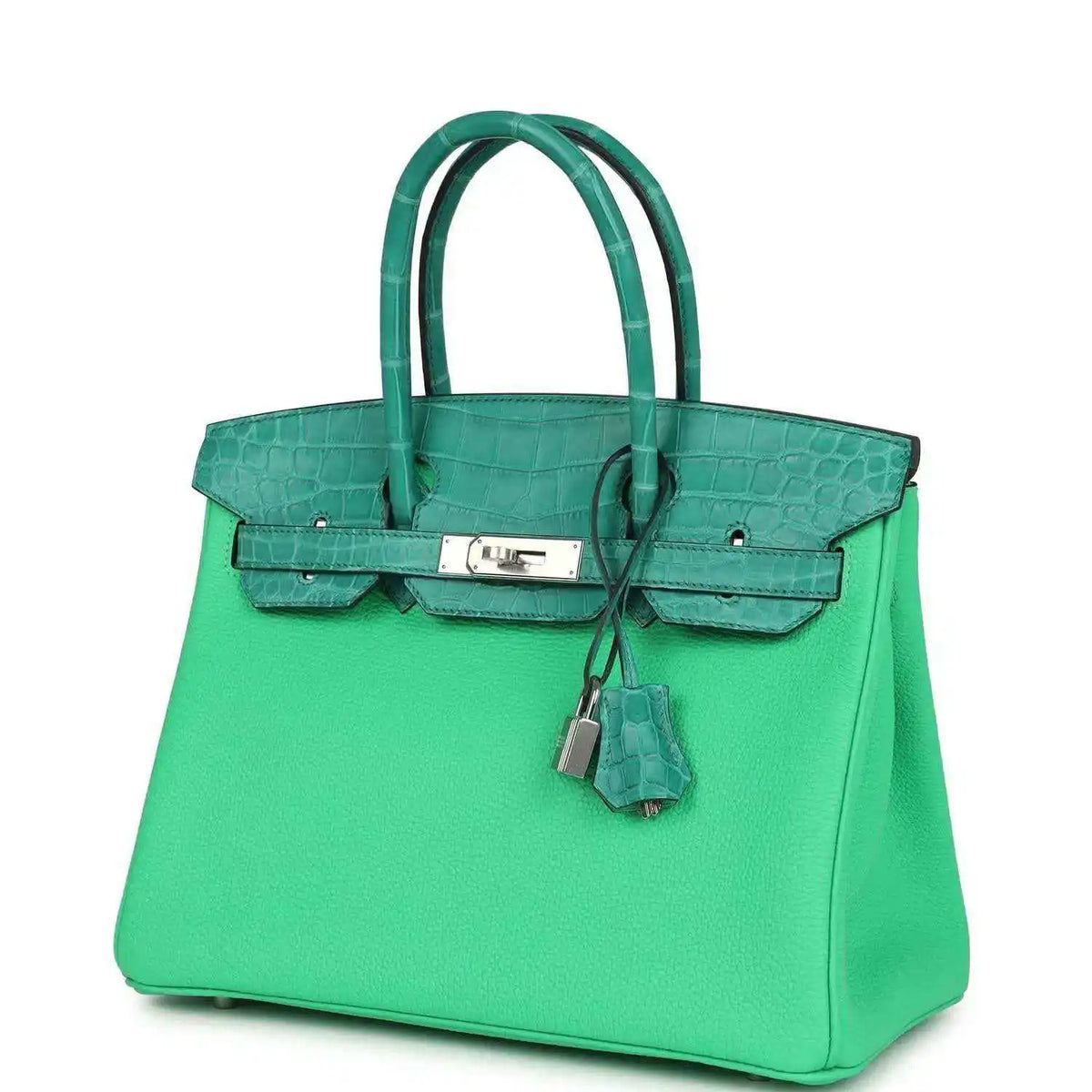 Green leather handbag with crocodile texture, front clasp, and hanging lock charm