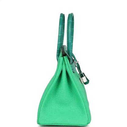 Green leather handbag with double top handles and dangling lock charm