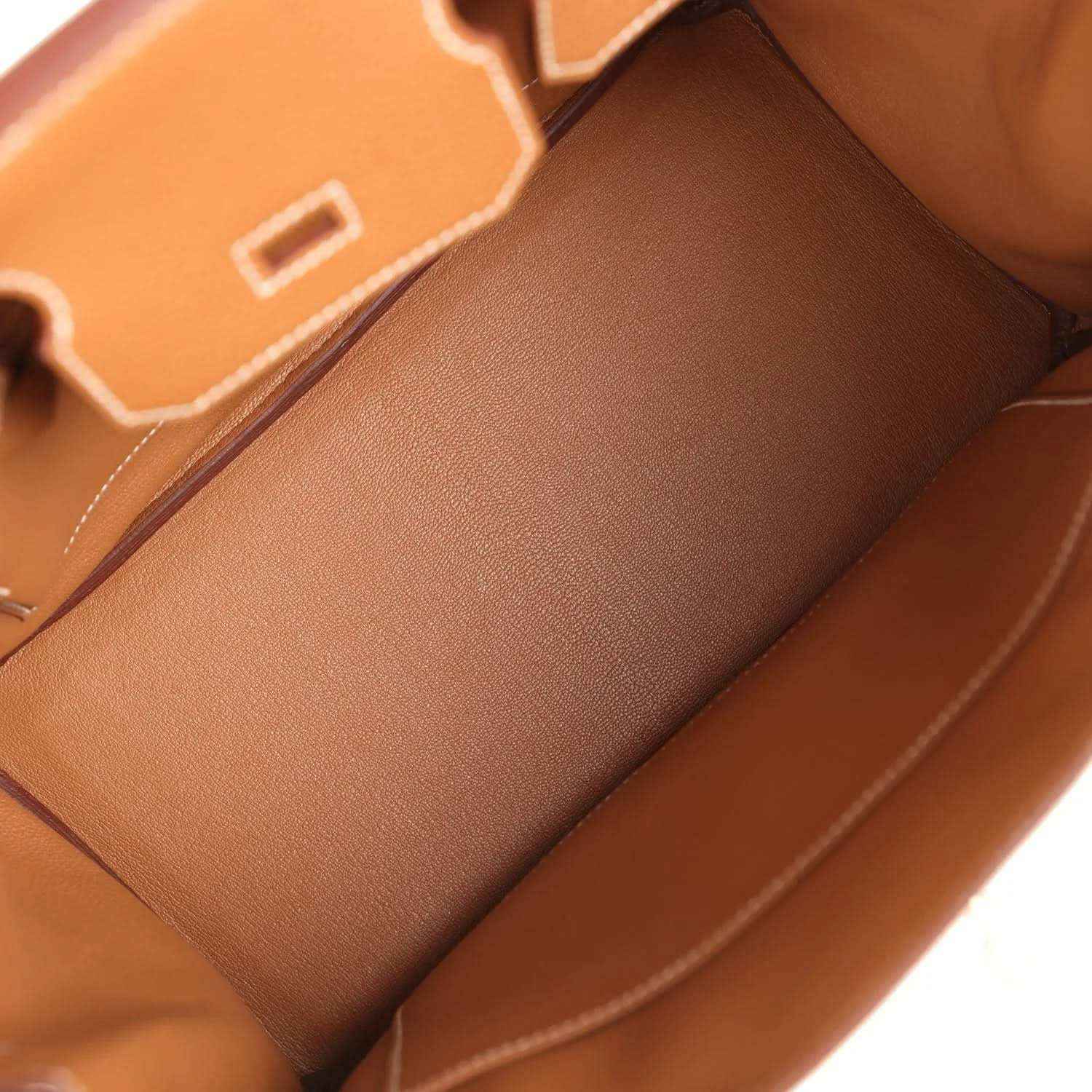 Hermes Birkin 30 handbag interior view with gold-brown leather lining and partitioned pocket