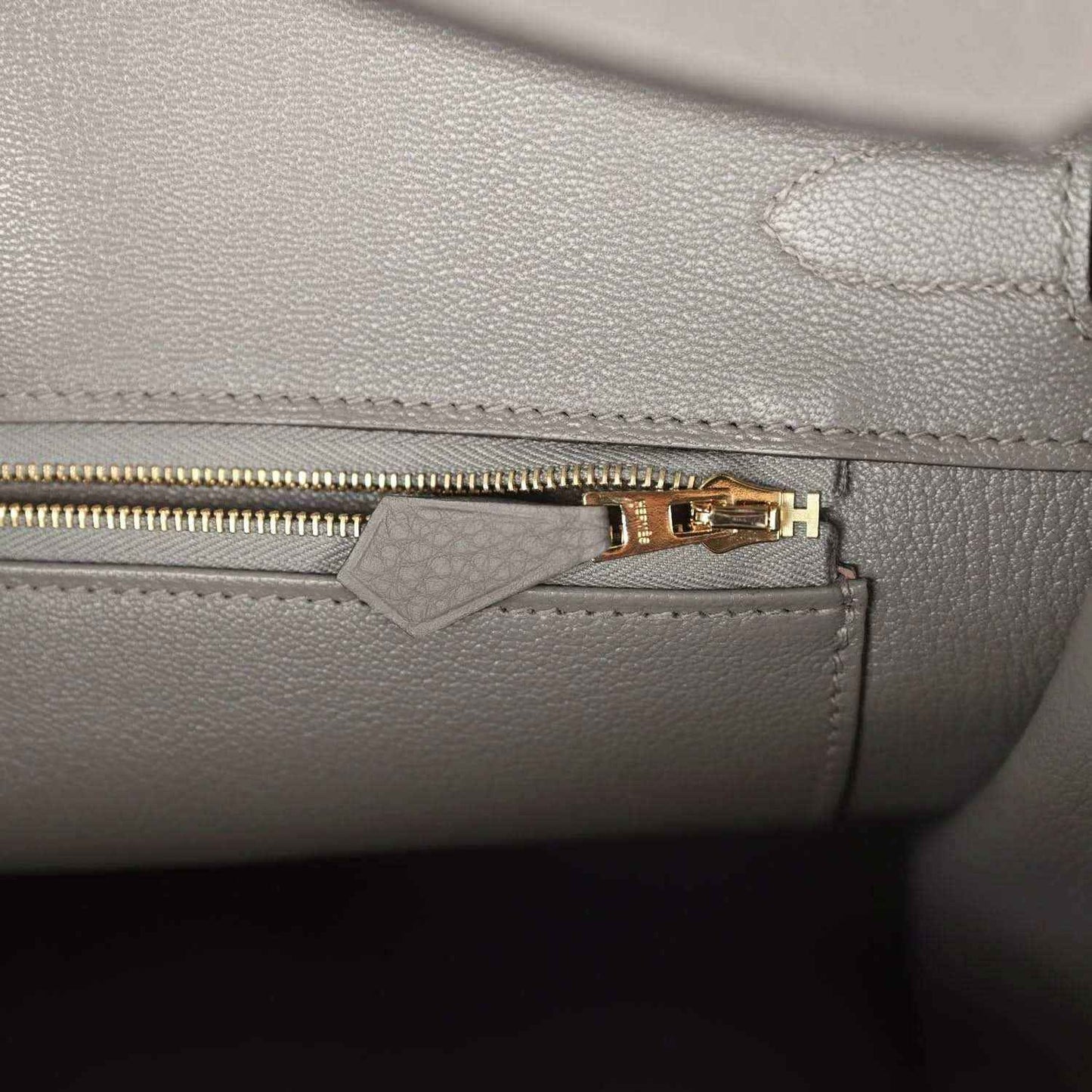 Hermes Birkin 35 handbag close-up of zipper pull and stitching on interior