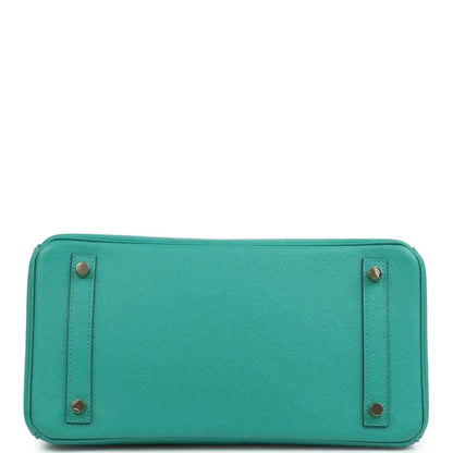 Green leather handbag base with reinforced corners and gold-tone feet