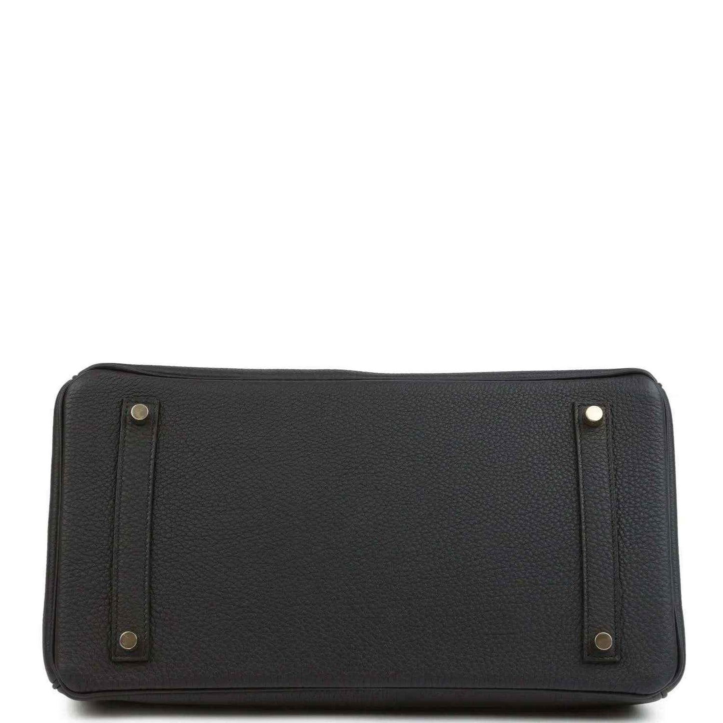 Black leather handbag with reinforced base corners and side handle attachments