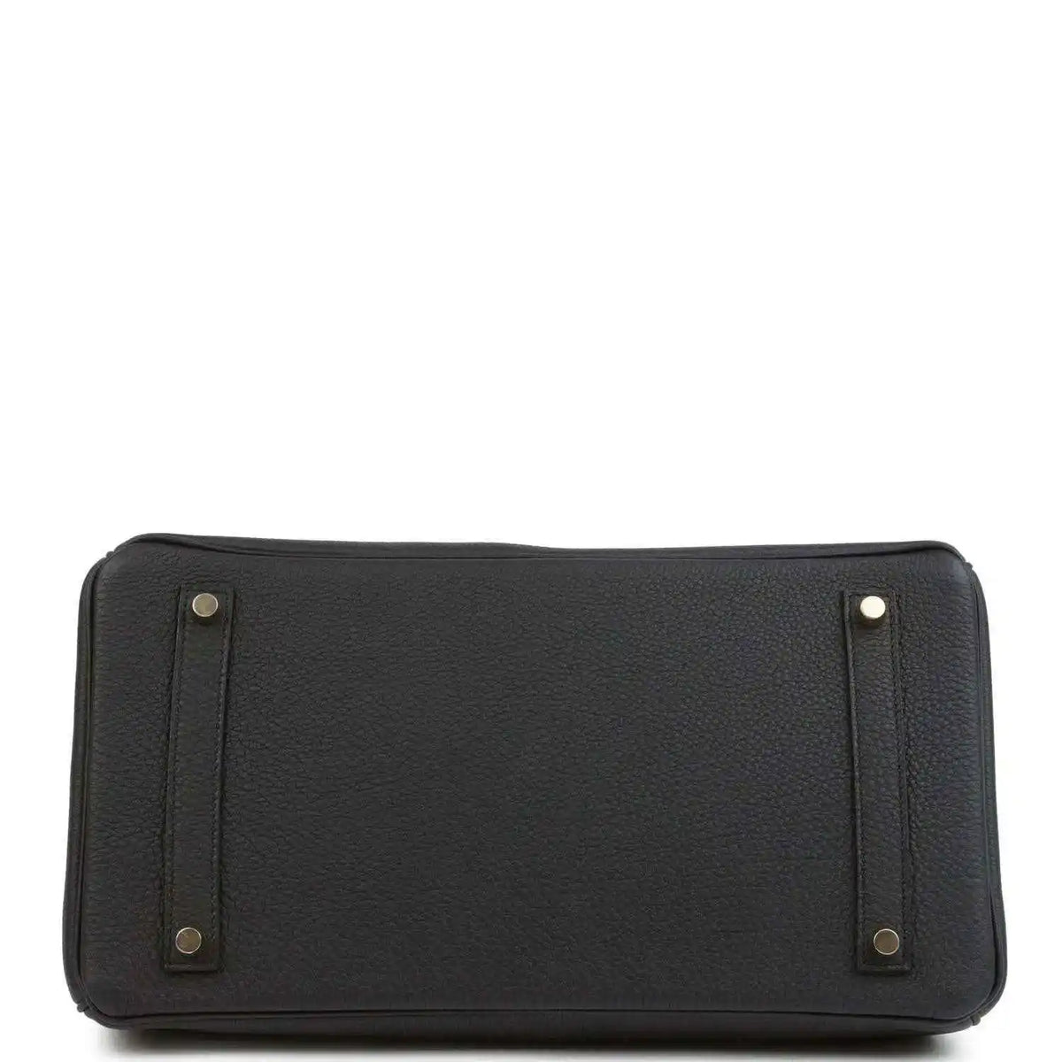 Black leather handbag with reinforced base corners and side handle attachments