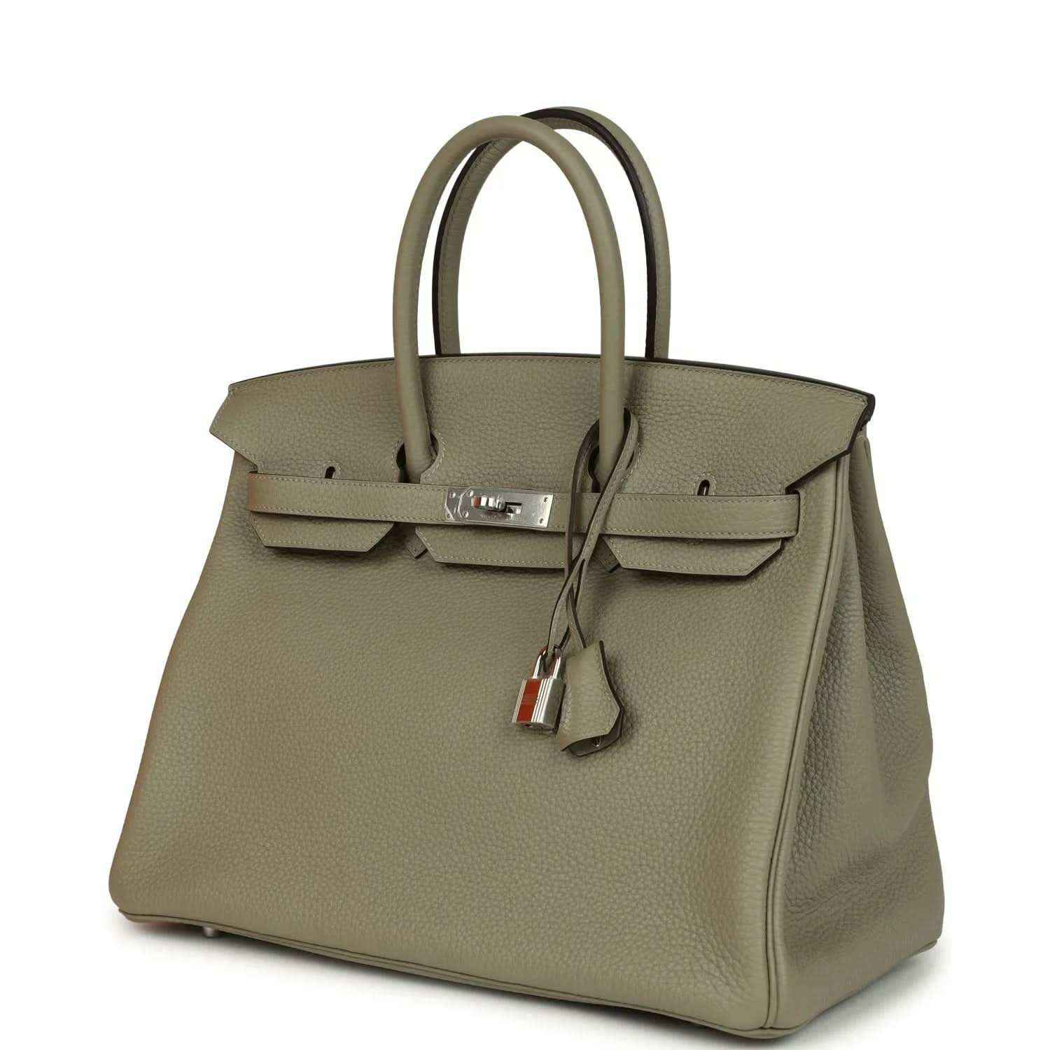 Sauge leather top-handle handbag with front flap, lock hardware, and key charm