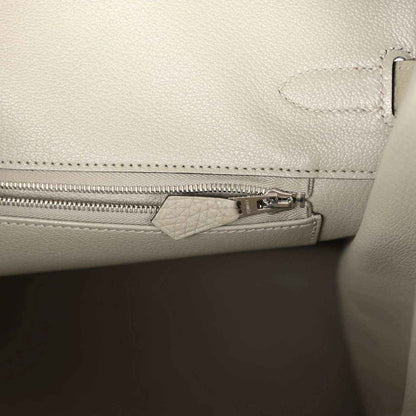 Sauge leather handbag with interior zip pocket and metal zipper pull