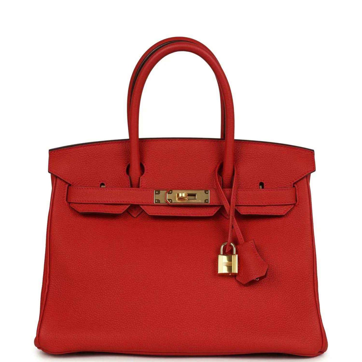 Red leather handbag with gold front clasp, lock, and top handles
