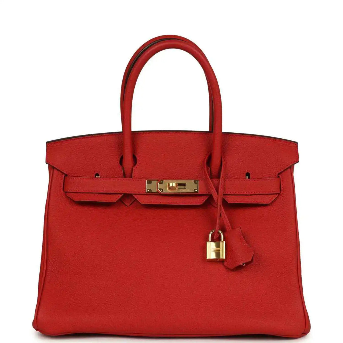 Red leather handbag with gold front clasp, lock, and top handles