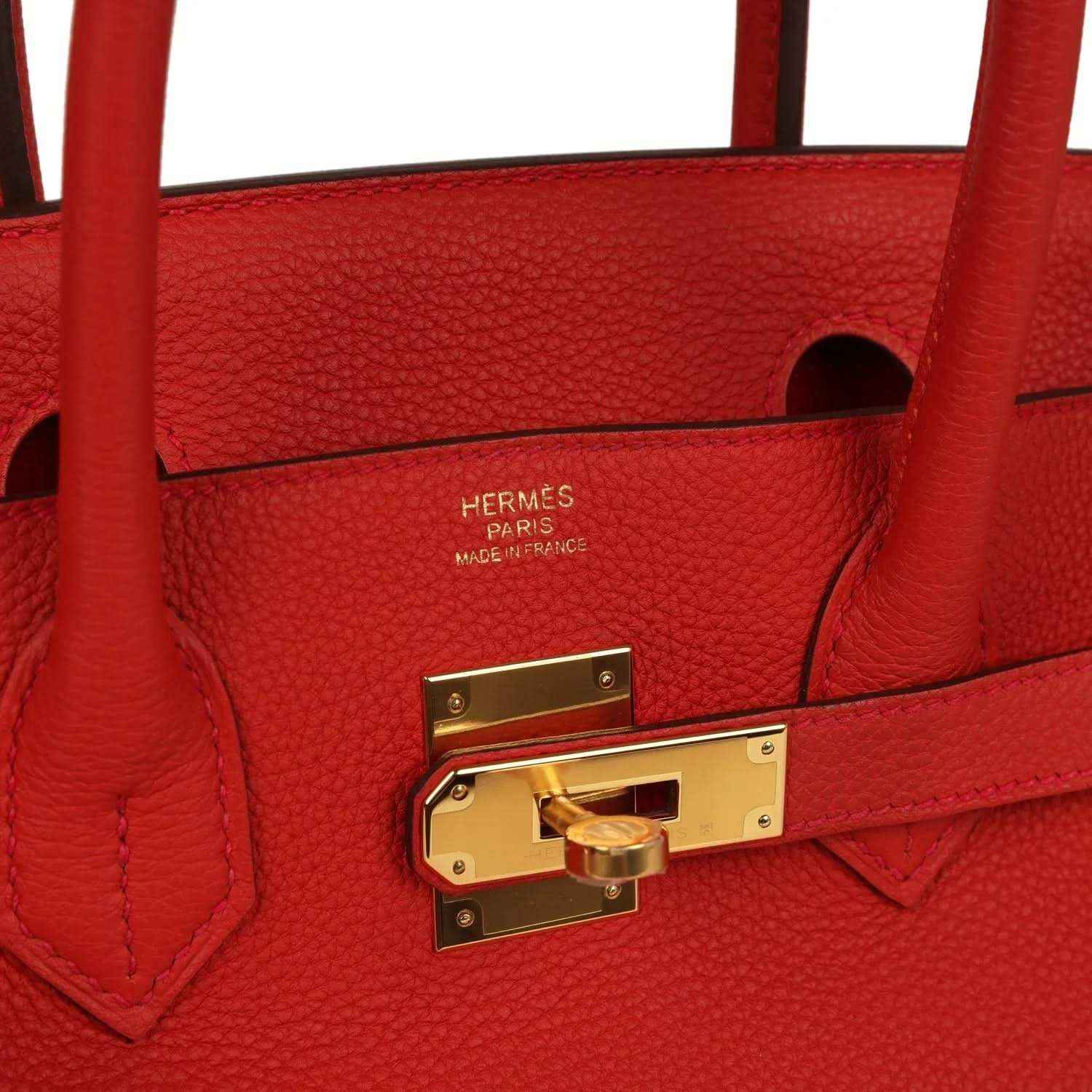Hermes leather handbag interior with gold turn-lock and maker stamp