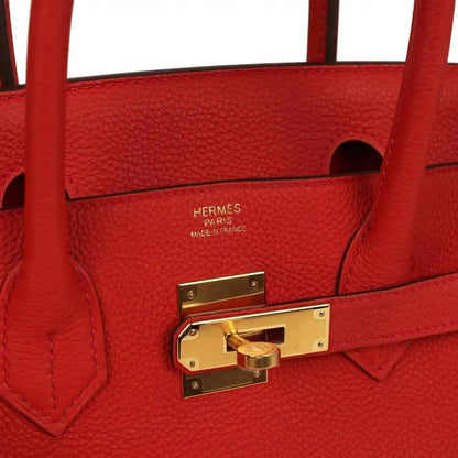 Hermes leather handbag interior with gold turn-lock and maker stamp