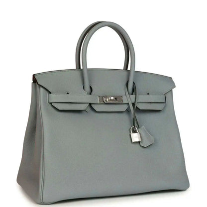 Gray Birkin 35 handbag with silver-tone hardware, front flap, and hanging key charm