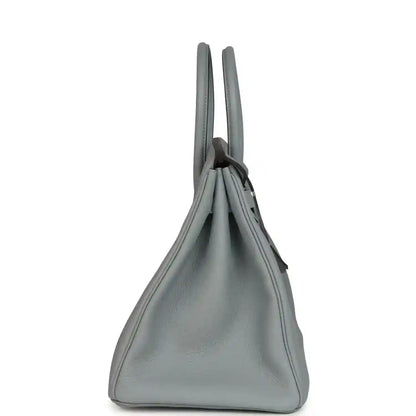 Gray Togo leather Birkin 35 handbag side view with top handles and curved silhouette