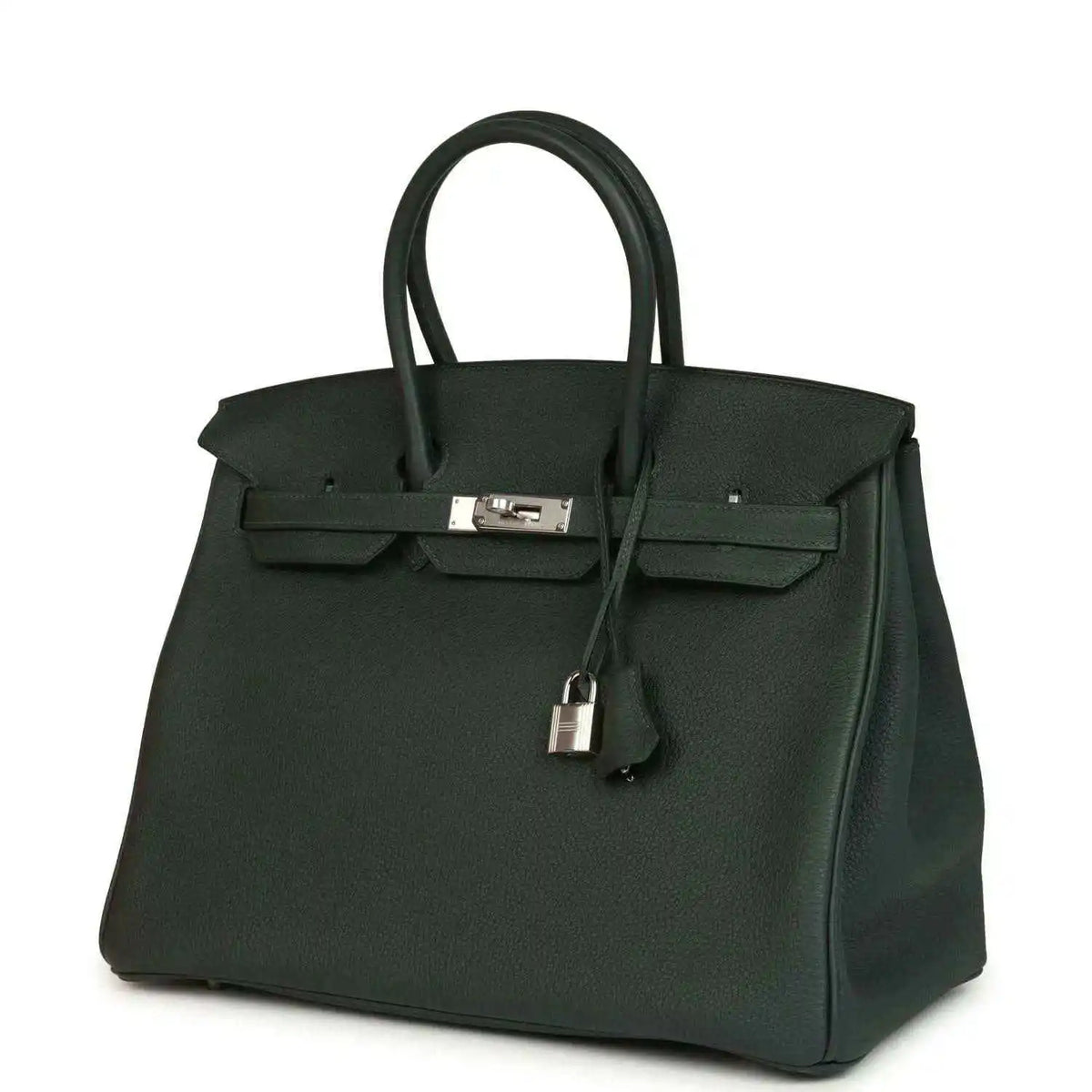 Dark green Togo leather handbag with top handles and silver-tone front lock, angled view