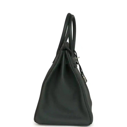 Togo leather handbag in dark green with side profile, top handles, and silver-tone hardware