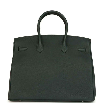 Dark green Togo leather handbag with front flap, top handles, and silver-tone hardware
