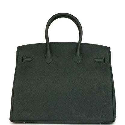 Dark green Togo leather handbag with front flap, top handles, and silver-tone hardware