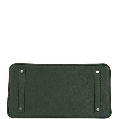 Dark green Togo leather handbag with two side snap tabs, flat front panel view