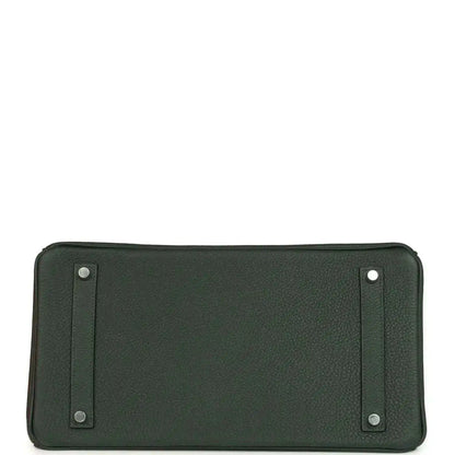 Dark green Togo leather handbag with two side snap tabs, flat front panel view