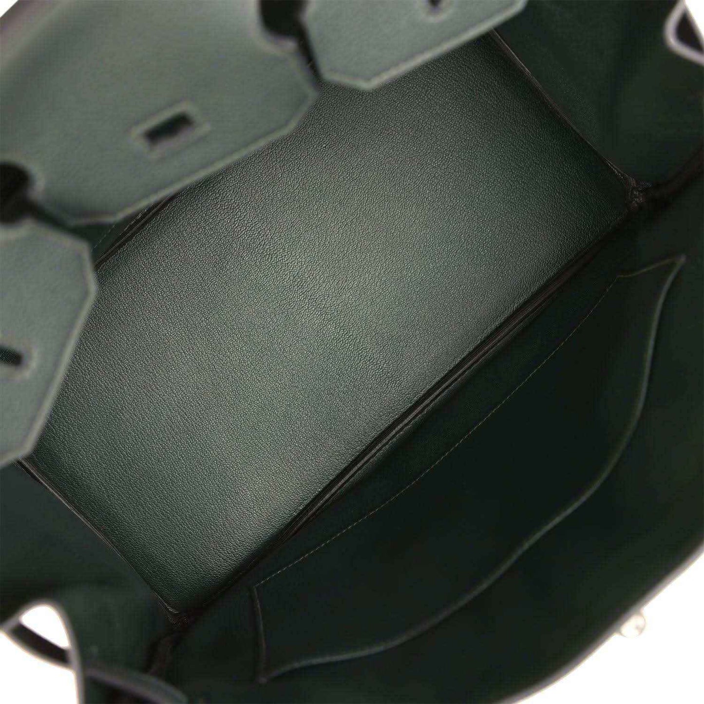 Dark green Togo leather handbag interior panel with smooth lining and side seam